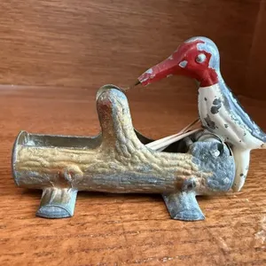 Woodpecker toothpick dispenser