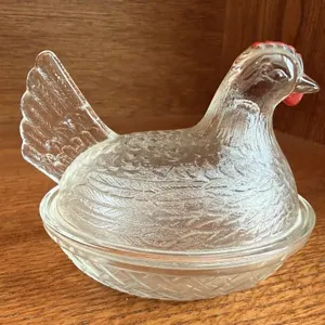 Clear glass hen on nest