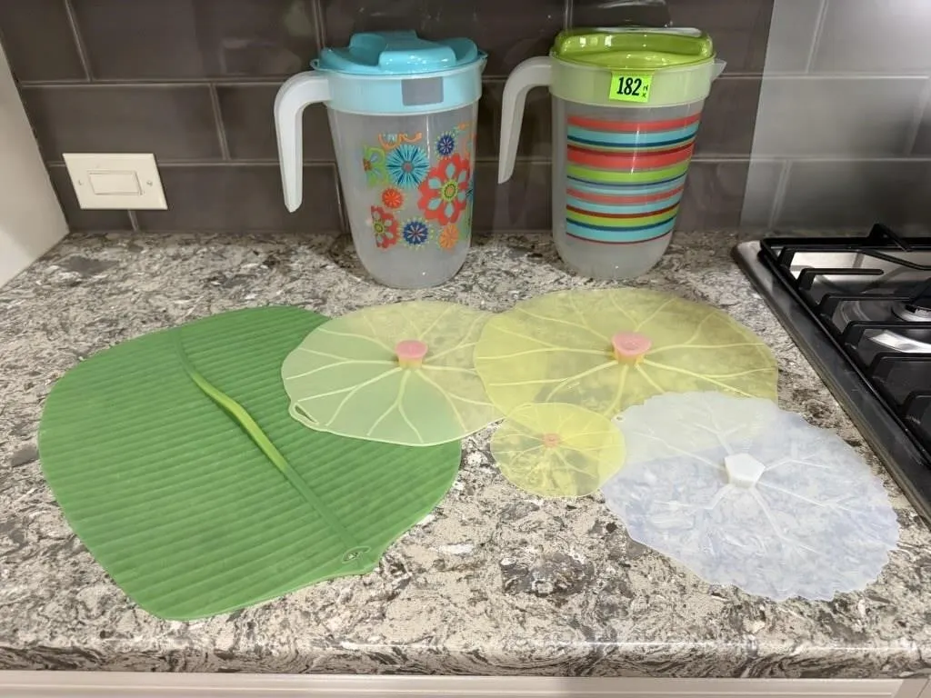 Plastic beverage pitchers (2), silicone lids