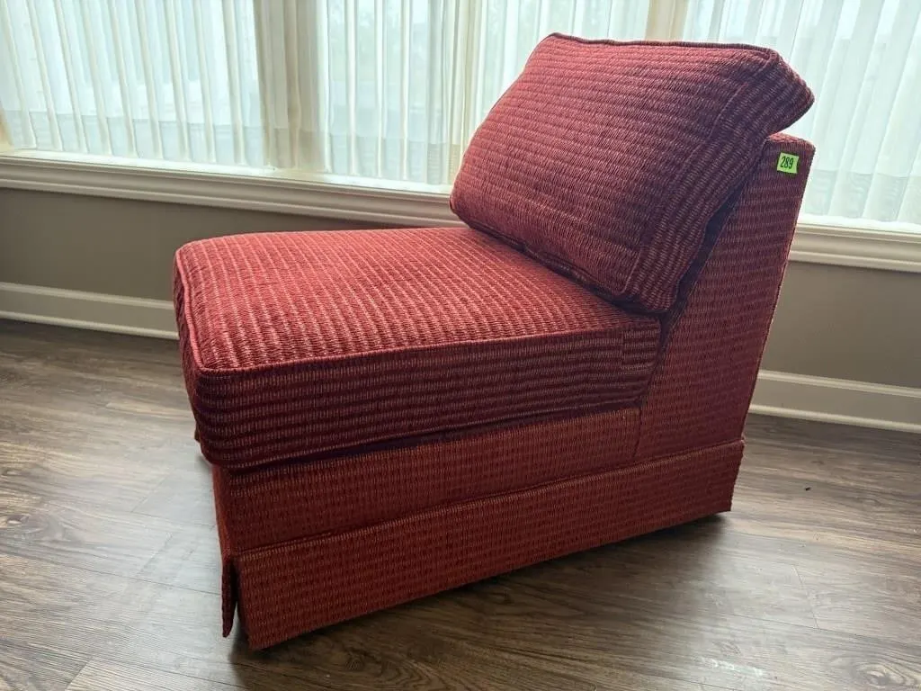 Red armless easy chair