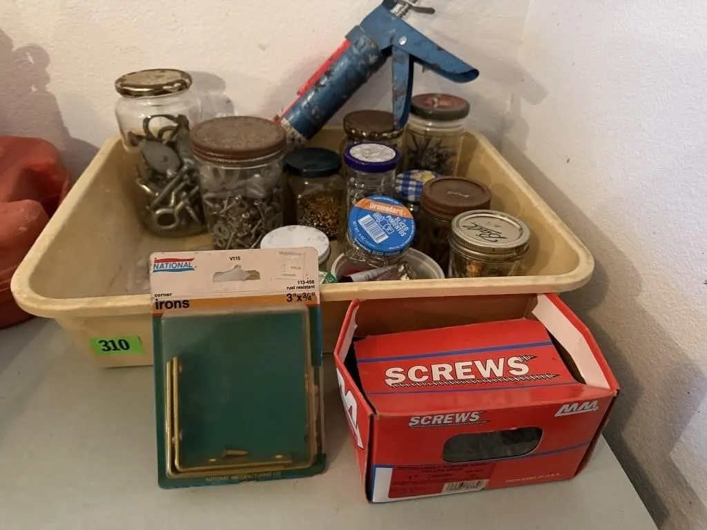 Assorted hardware, pulleys, screws, caulk gun