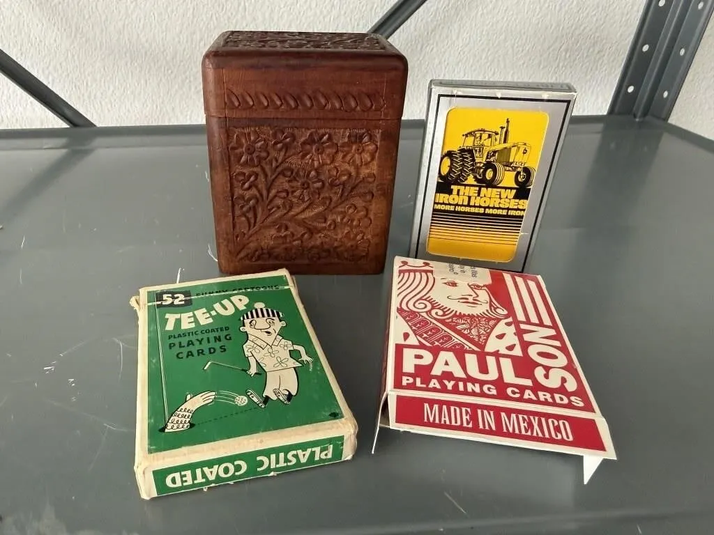 Assorted playing cards, wood carved card box