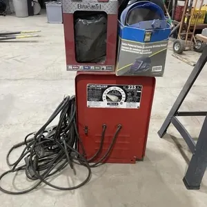 225 Lincoln Electric Welder W/ 3 Helmets & Rods