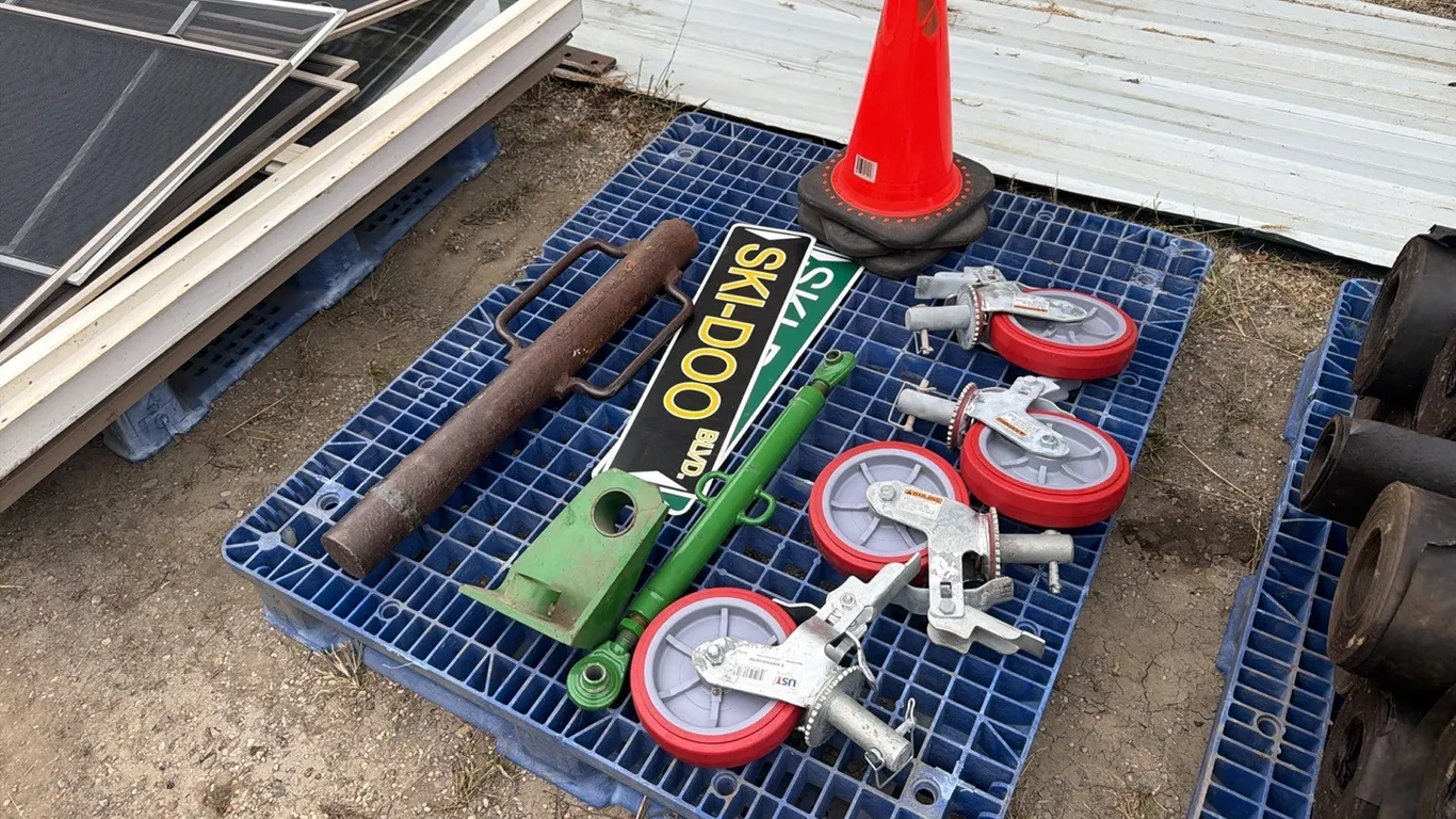 4) Unused UST scaffolding wheels w/ post hole pounder, & construction cones