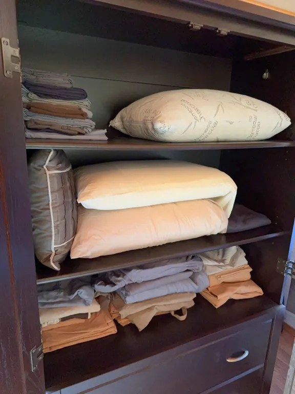 Pillows and Folded Bed Linens Lot