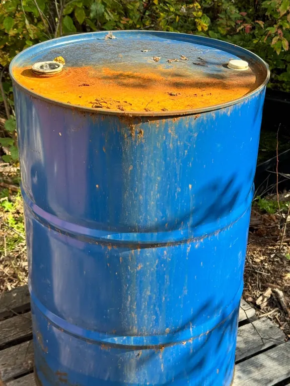 Galvanized Drum with Aged Fuel And Landscaping Roll