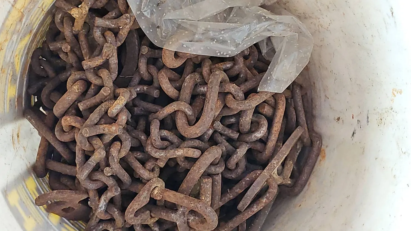Bucket of Rusted Heavy-Duty Metal Chains
