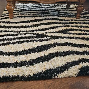 Black and White Shag Rug With Zebra Stripe Pattern
