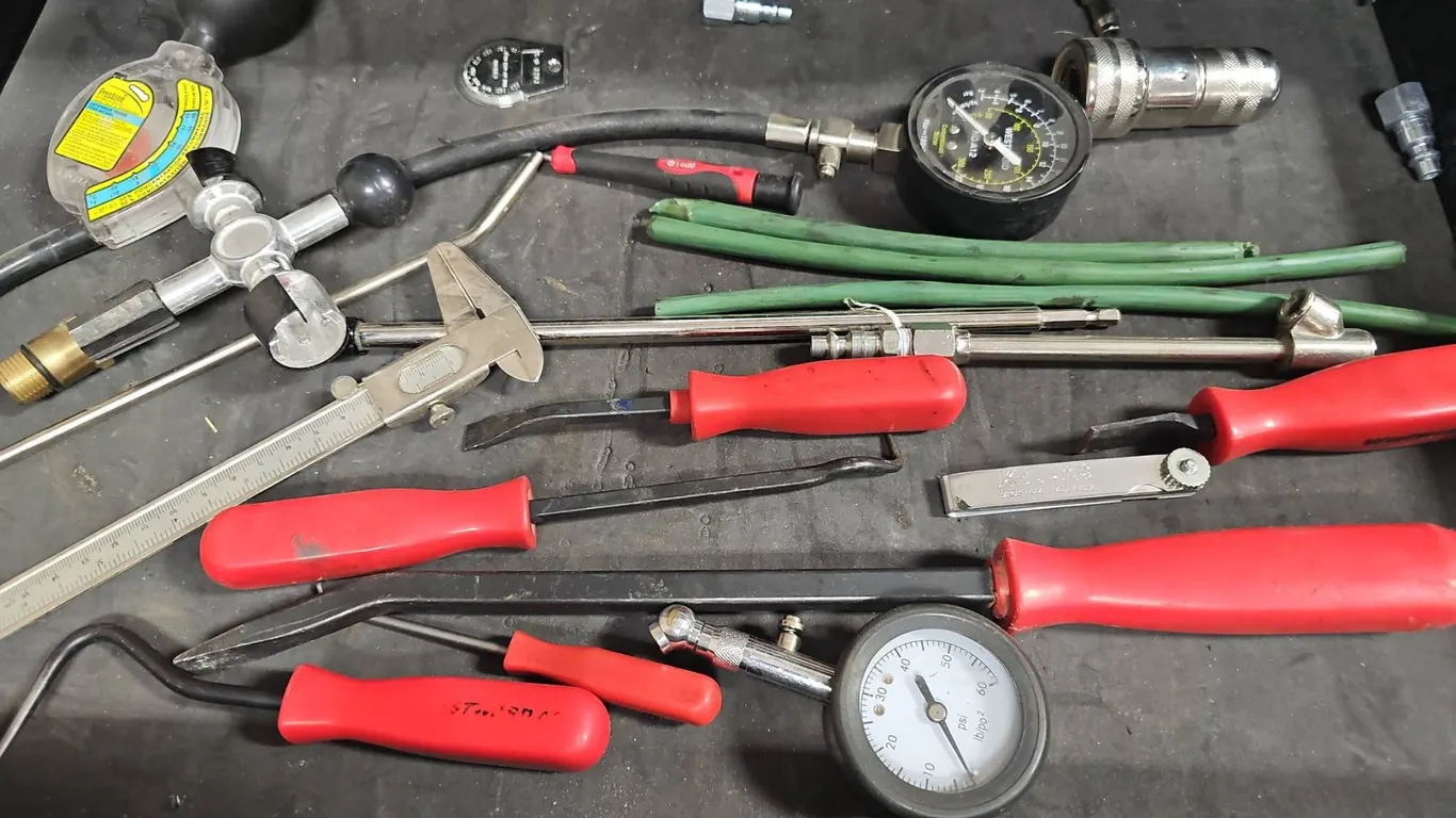 Automotive Diagnostic Tools with Pressure Gauges and Red Handles, Caliper Included