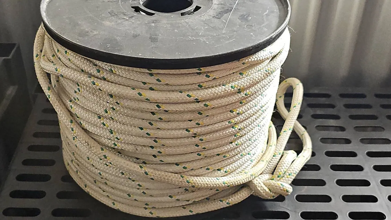 Spool of Braided White Rope With Yellow and Green Tracers