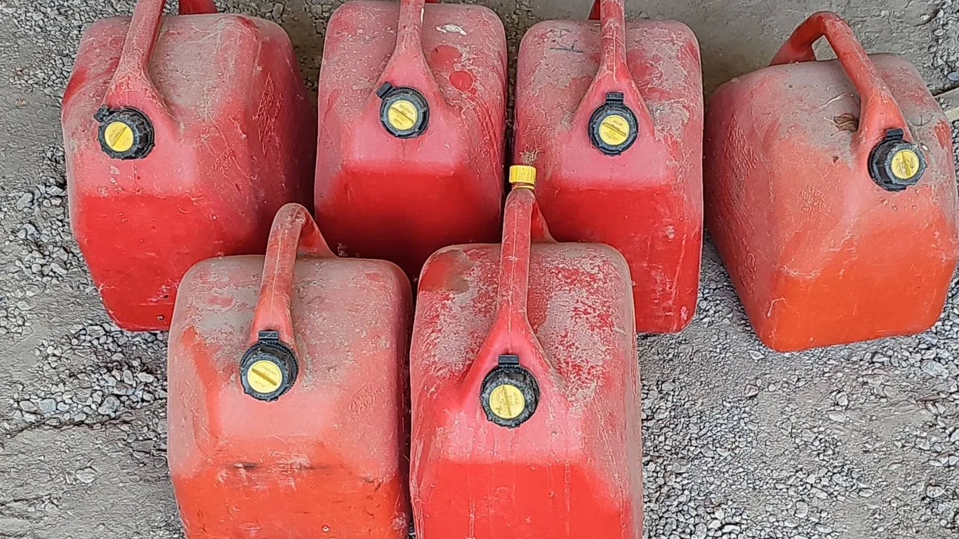 6 Red Plastic Gasoline Cans with Yellow Caps