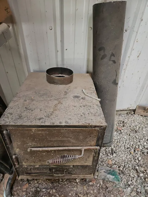 Metal Wood Burning Stove With Front Door And Removable Pipe
