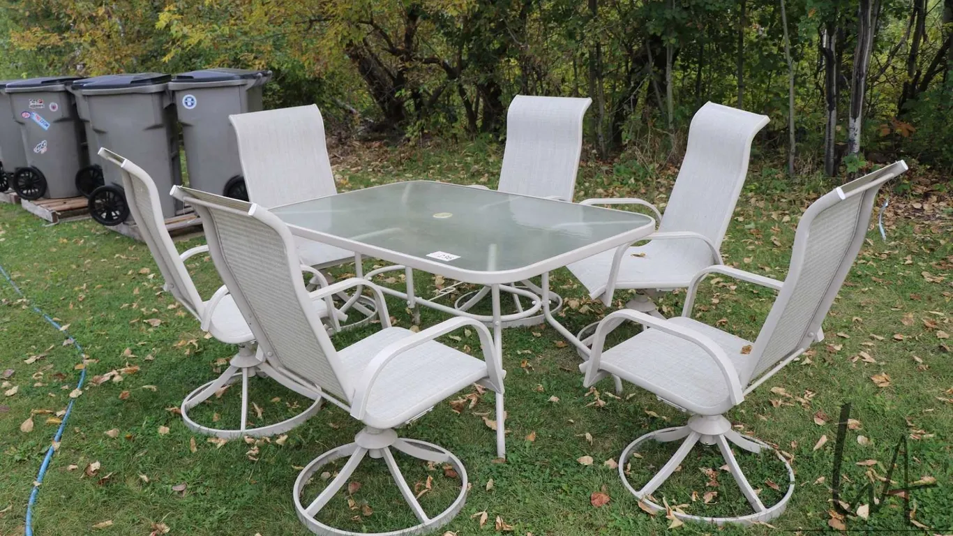 Patio table and six swivel armchairs in near new condition