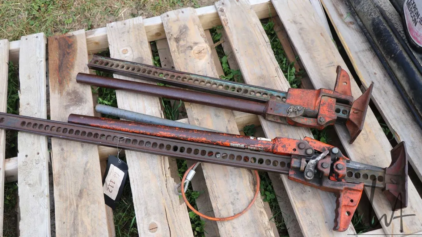 Two Jack-All jacks, one marked M-37 and the other 8000lbs