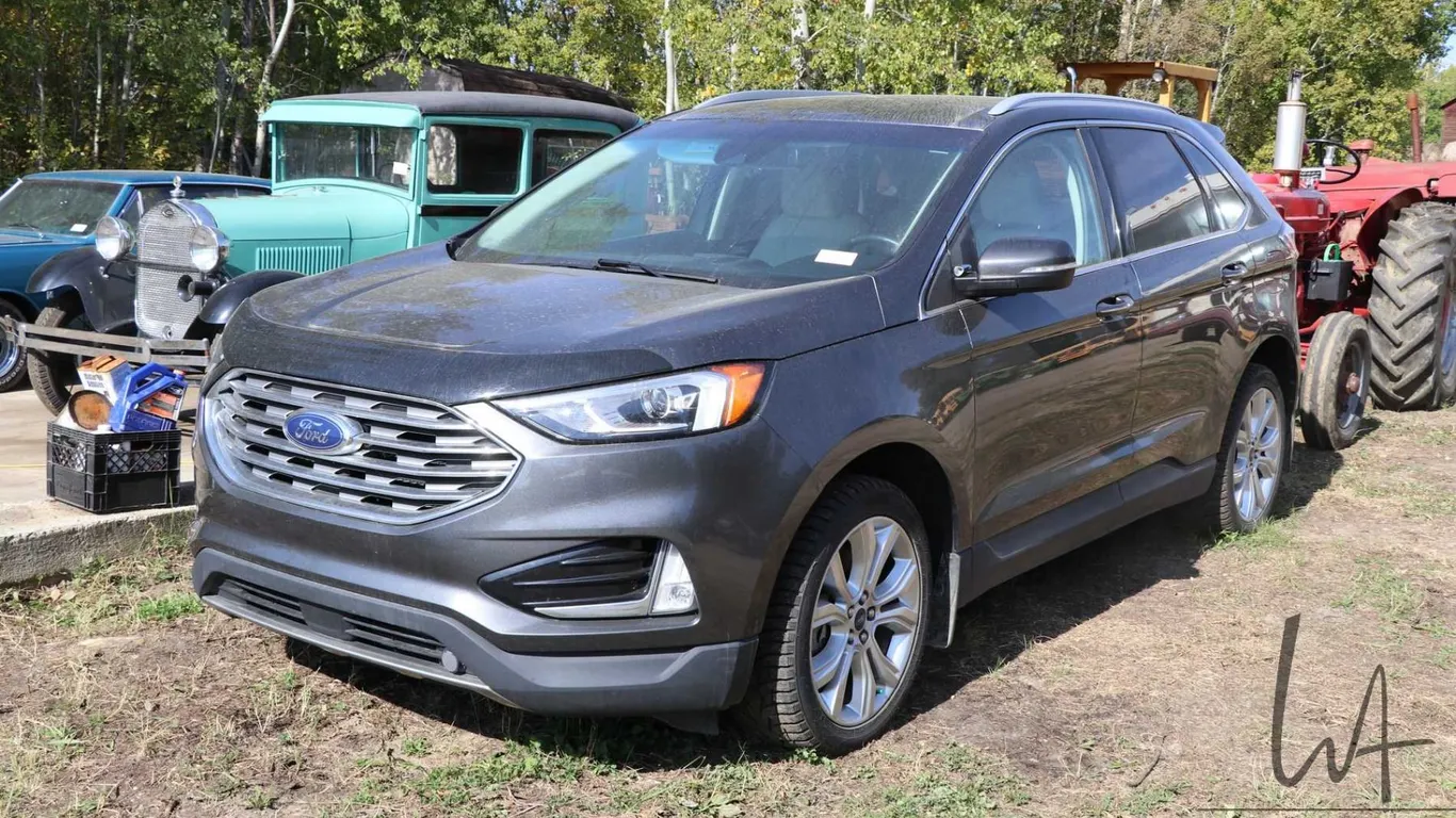 2020 (12/10) Ford Edge Titanium, 2.0 liter Eco-Boost, all wheel drive, three position memory seats,