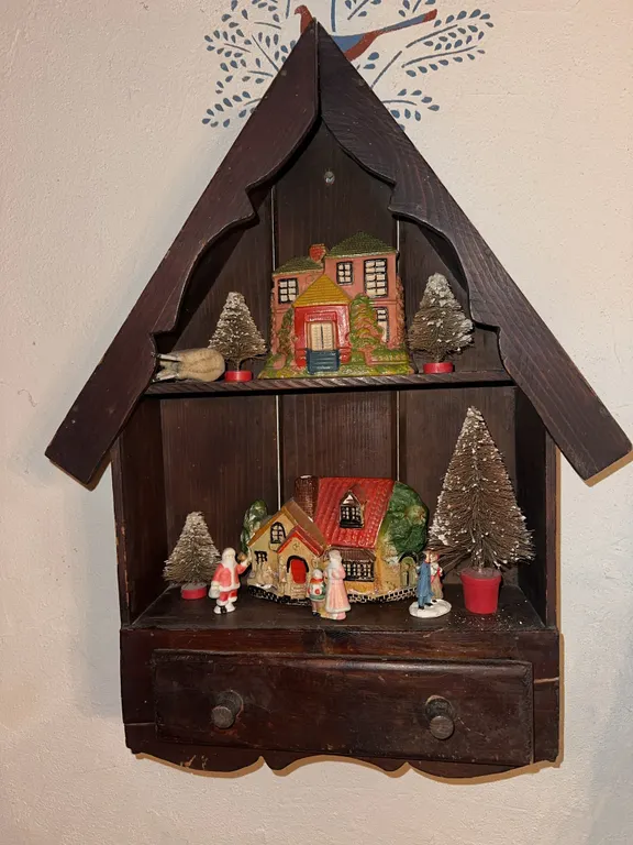 Primitive wooden house shaped wall shelf with miniatures