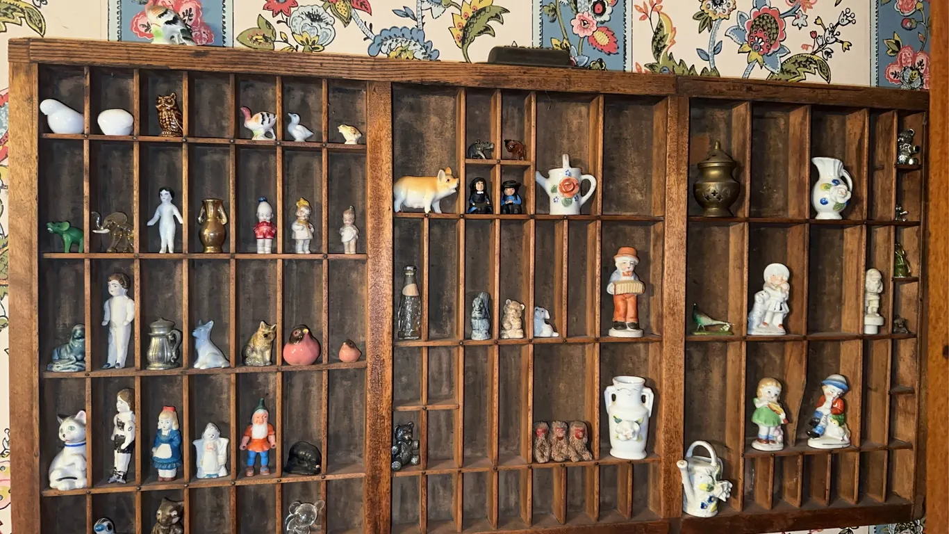 Antique printers tray filled with miniatures