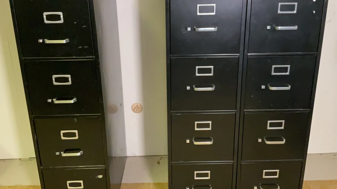 Three Tall Black Filing Cabinets