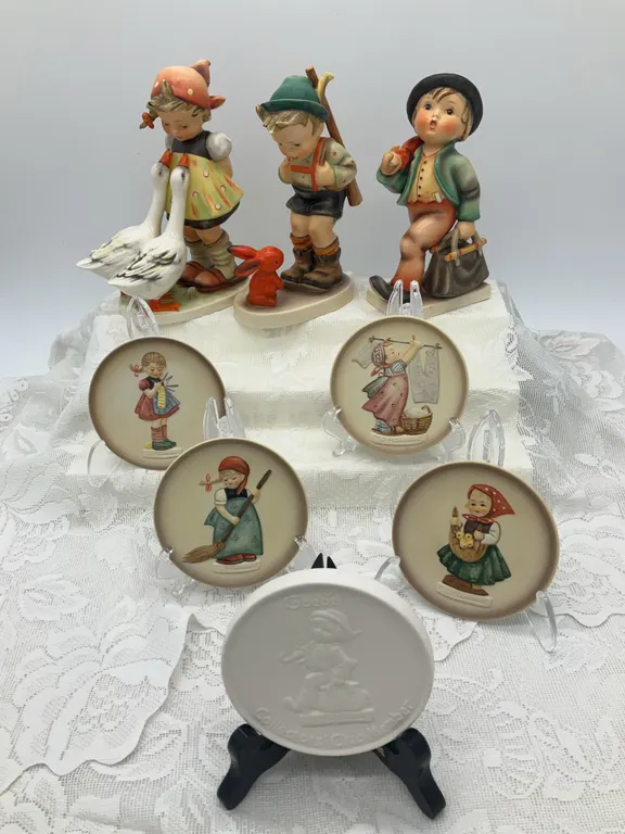 Large Hummel Figurines (6in and 7in), Four Collector Plates & a Collector’s Club Token