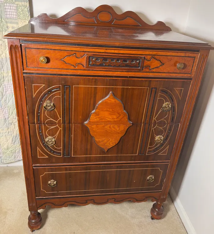 Vintage Four-Drawer Chest with Decorative Wood Detailing & Ornate Brass-Tone Pulls