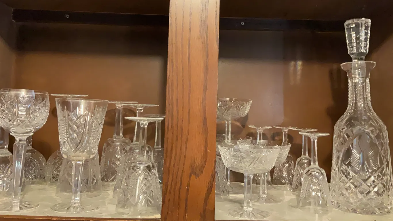 Set of Crystal Glassware, Including a Decanter and a Variety of Stemware