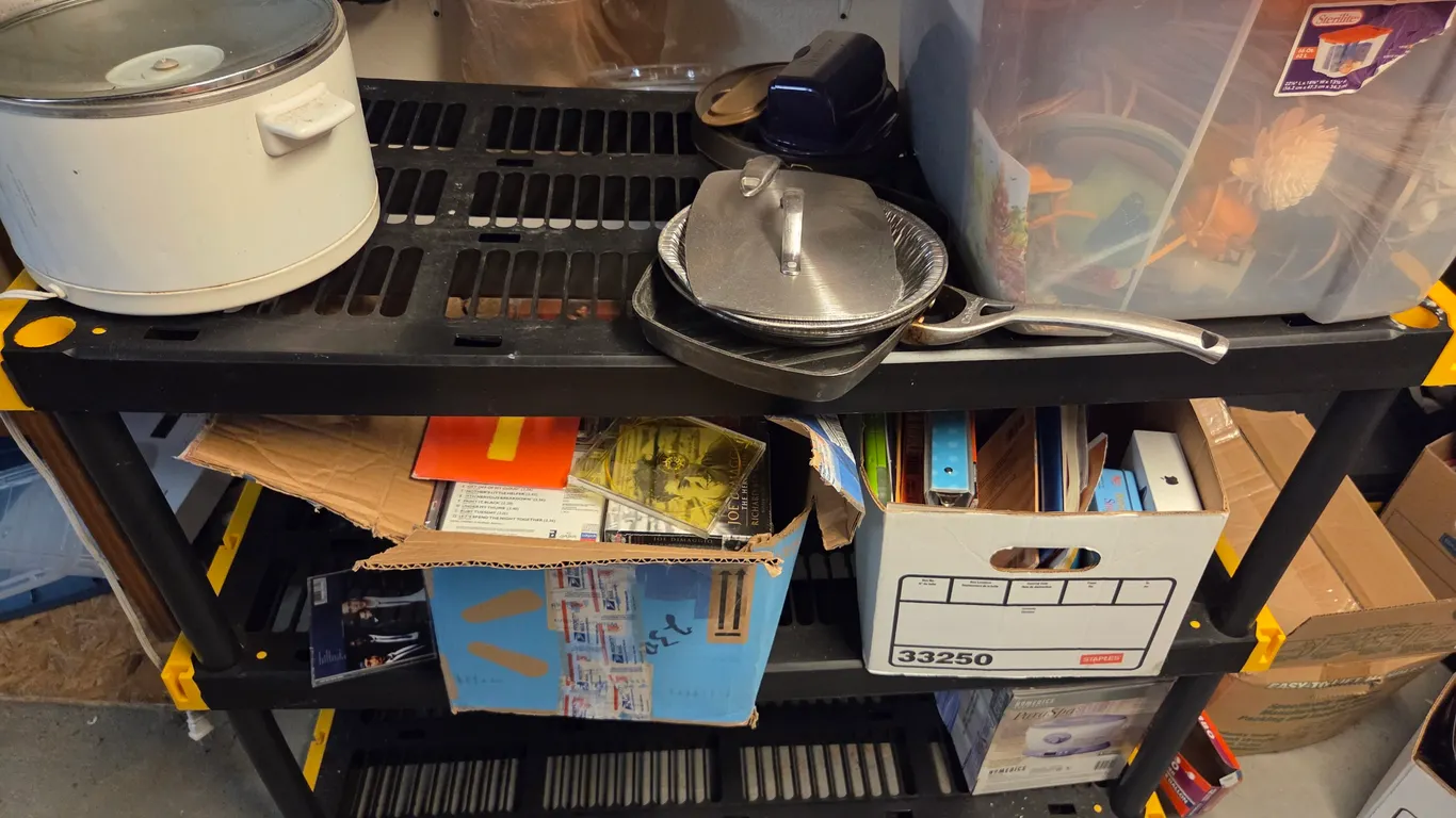 Shelf and contents including large box of CDs
