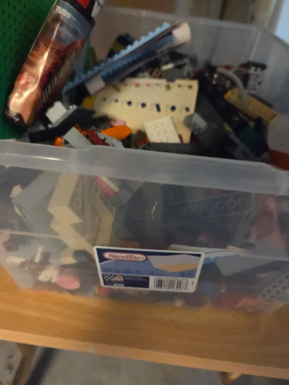 Box of Legos and mario wii game