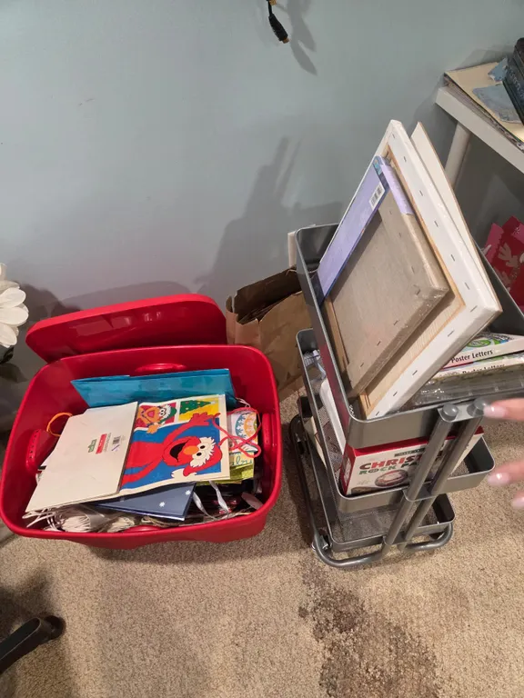Tote of gift bags and rolling organizer with craft supplies