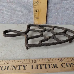 Vintage Cast Iron Trivet 8.75"X3.75"