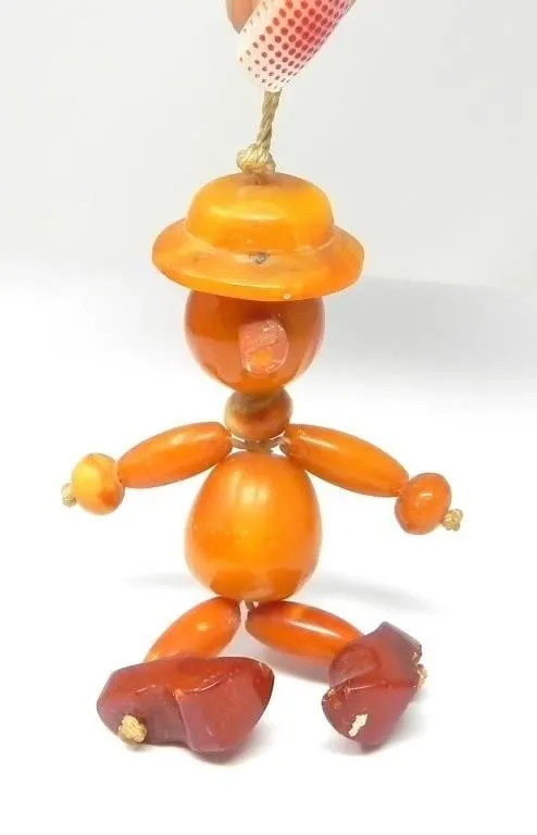 POLISHED AMBER PINOCCHIO PENDANT/FIGURE 12.19g
