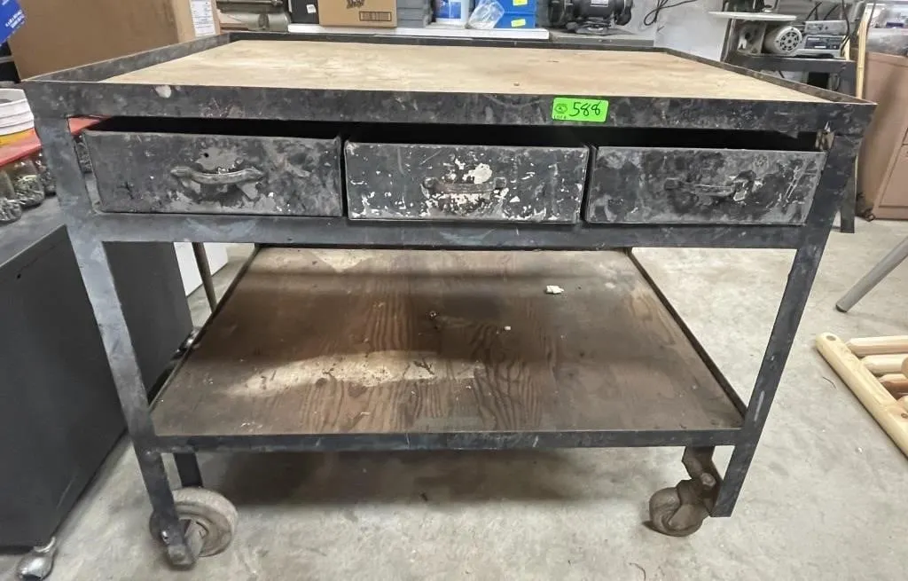 Rolling work table with drawers. On casters.