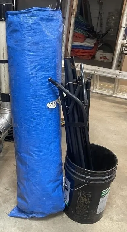 Screen tent with poles. Size unknown.