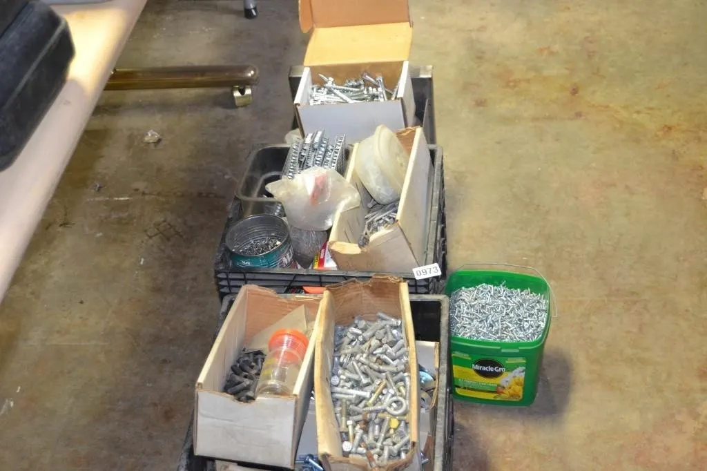 large assortment of nuts , bolts , screws
