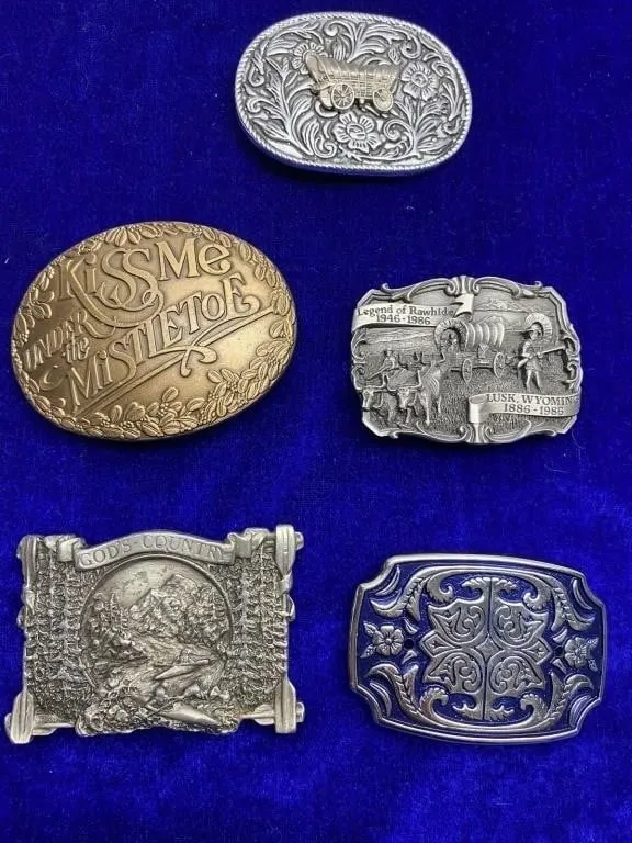 Five vintage western-themed metal belt buckles