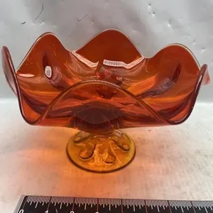 Amber/orange art glass ruffled-edge pedestal