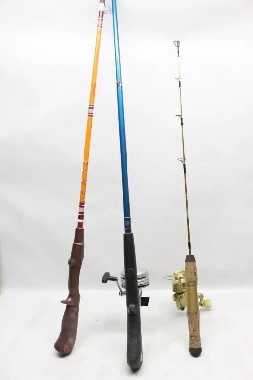 Three vintage spinning fishing rods with reels