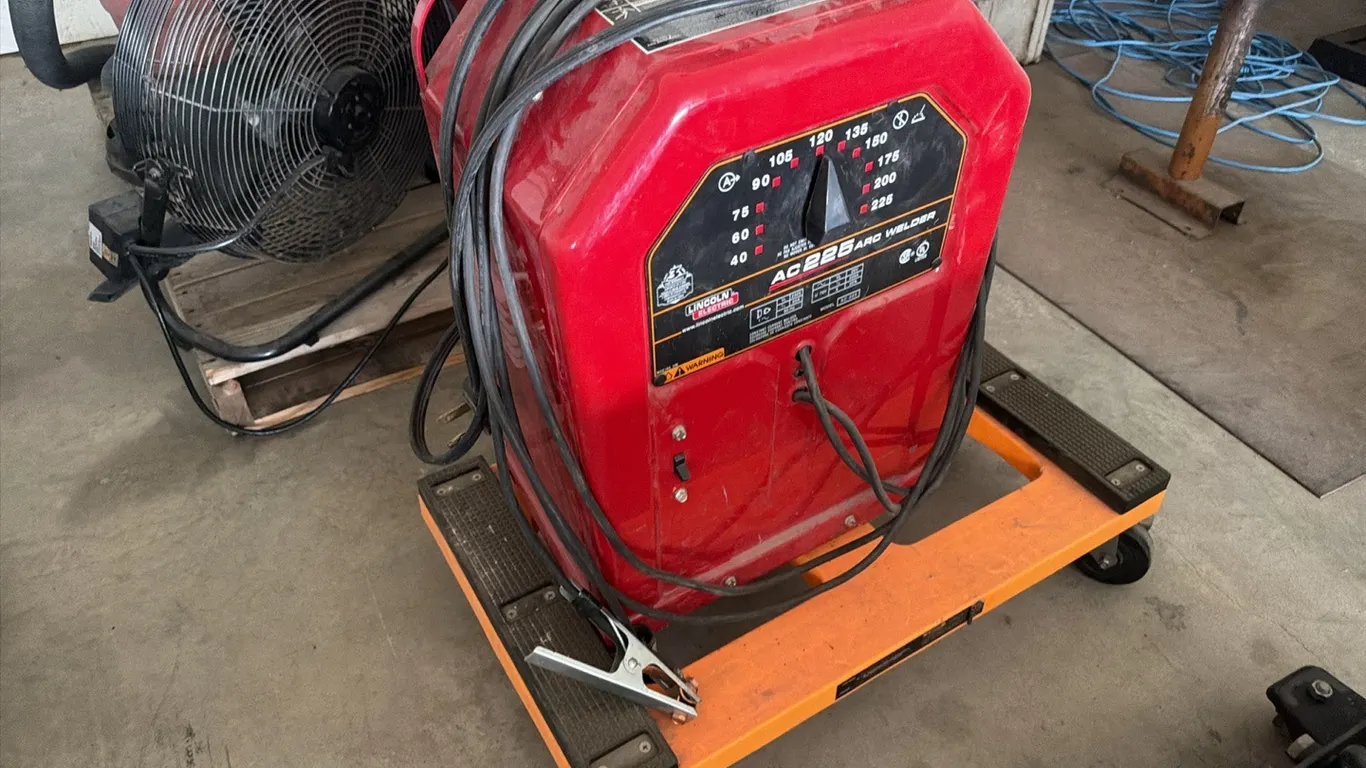 Lincoln AC/DC 225 arc welder on portable cart