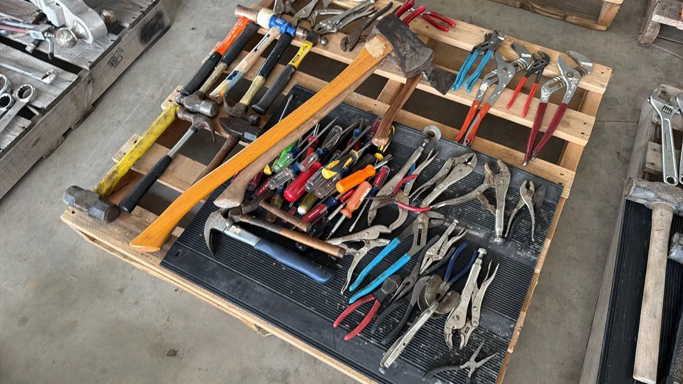 Assorted tools, including axes, hammers, pliers, vise grips & screw drivers