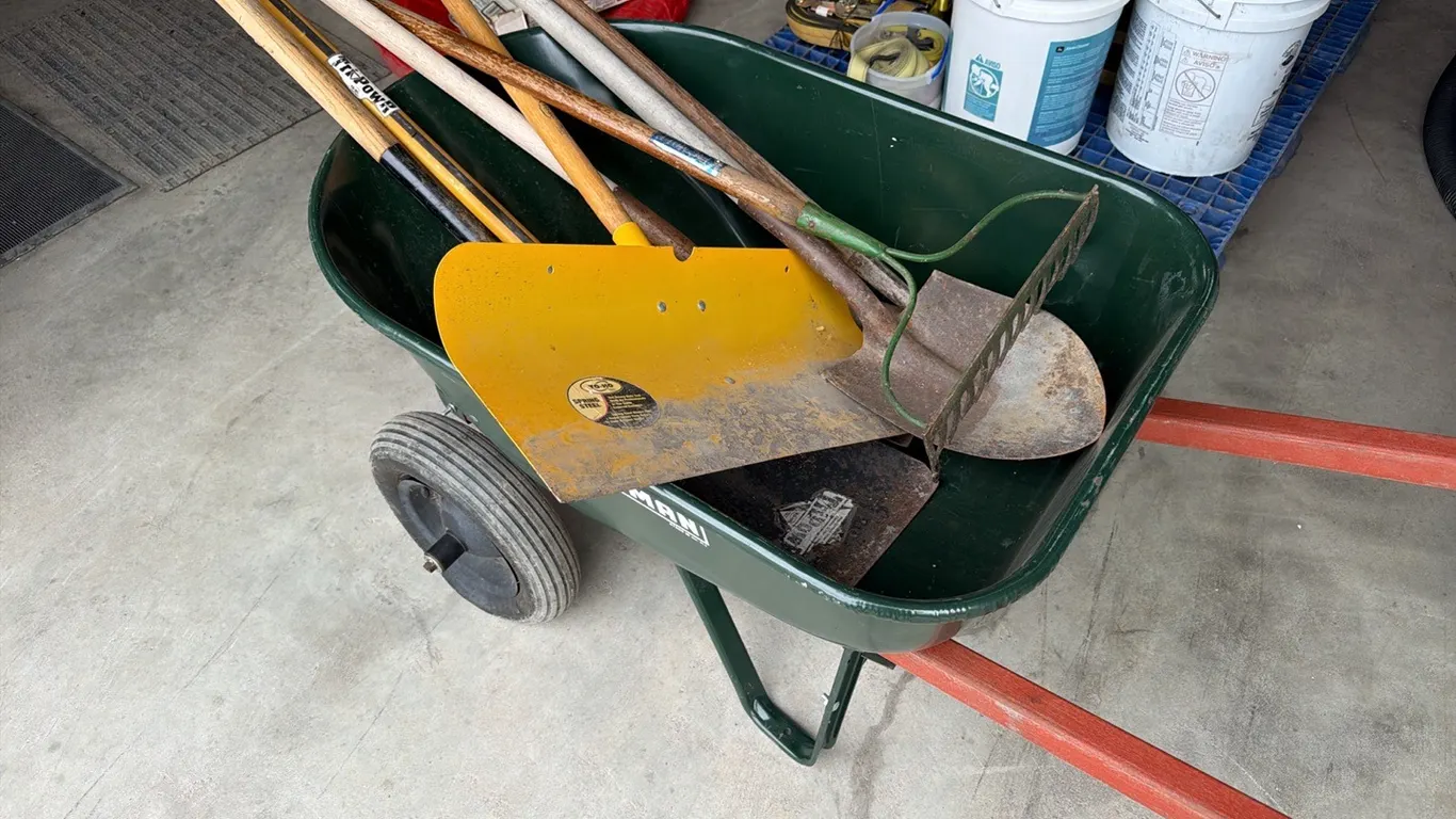 Craftsman's wheelbarrow w/ assorted yard tools
