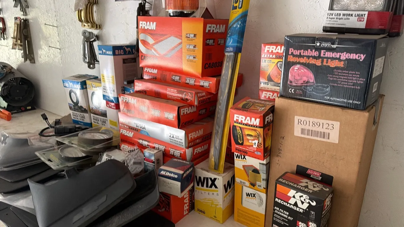 Large quantity of assorted auto parts, including assorted filter, splash guards, LD tow lights & weather strips