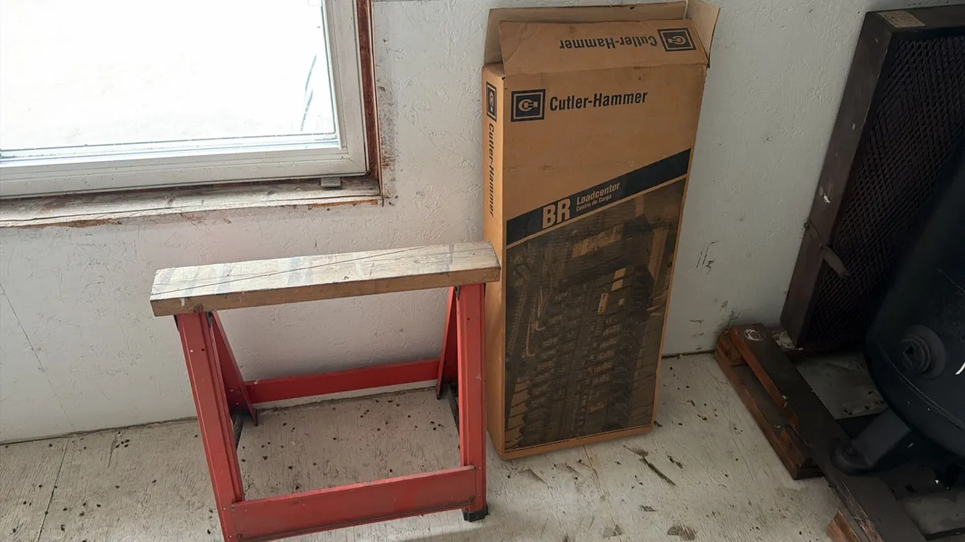 Unused Cutler-Hammer load center & sawhorse