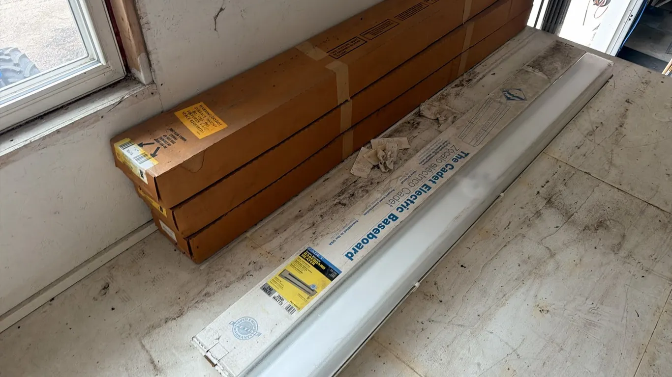 Unused Cadet 96" 2000w electric baseboards w/ 96" shop light & 3) unused 96" light fixtures