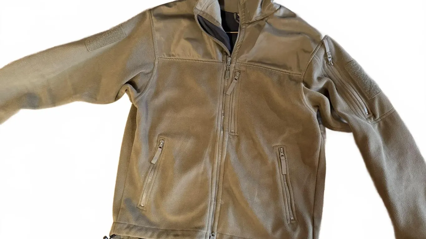 Olive Green Tactical Softshell Jacket with Multiple Zippered Pockets and Drawstring Hem