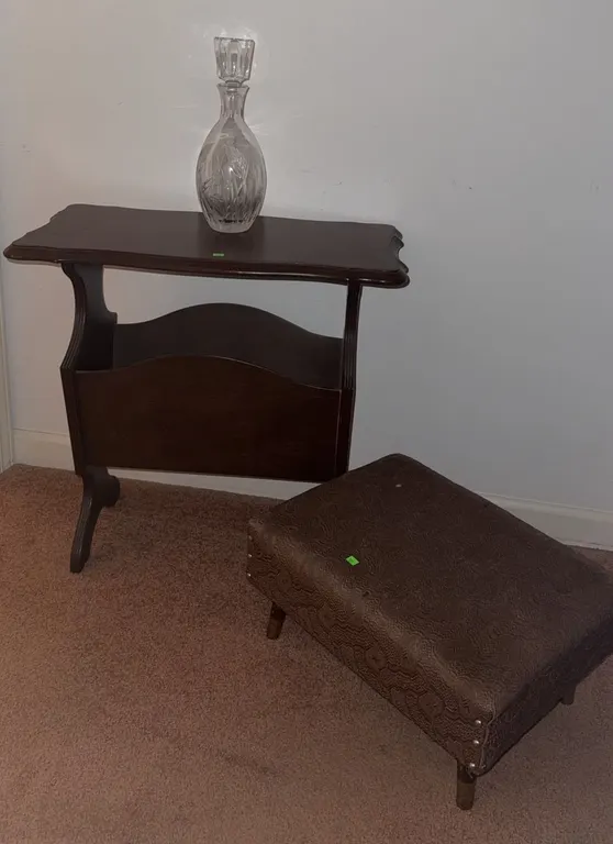 Wood Magazine Rack Table With Glass Decanter and Upholstered Footstool