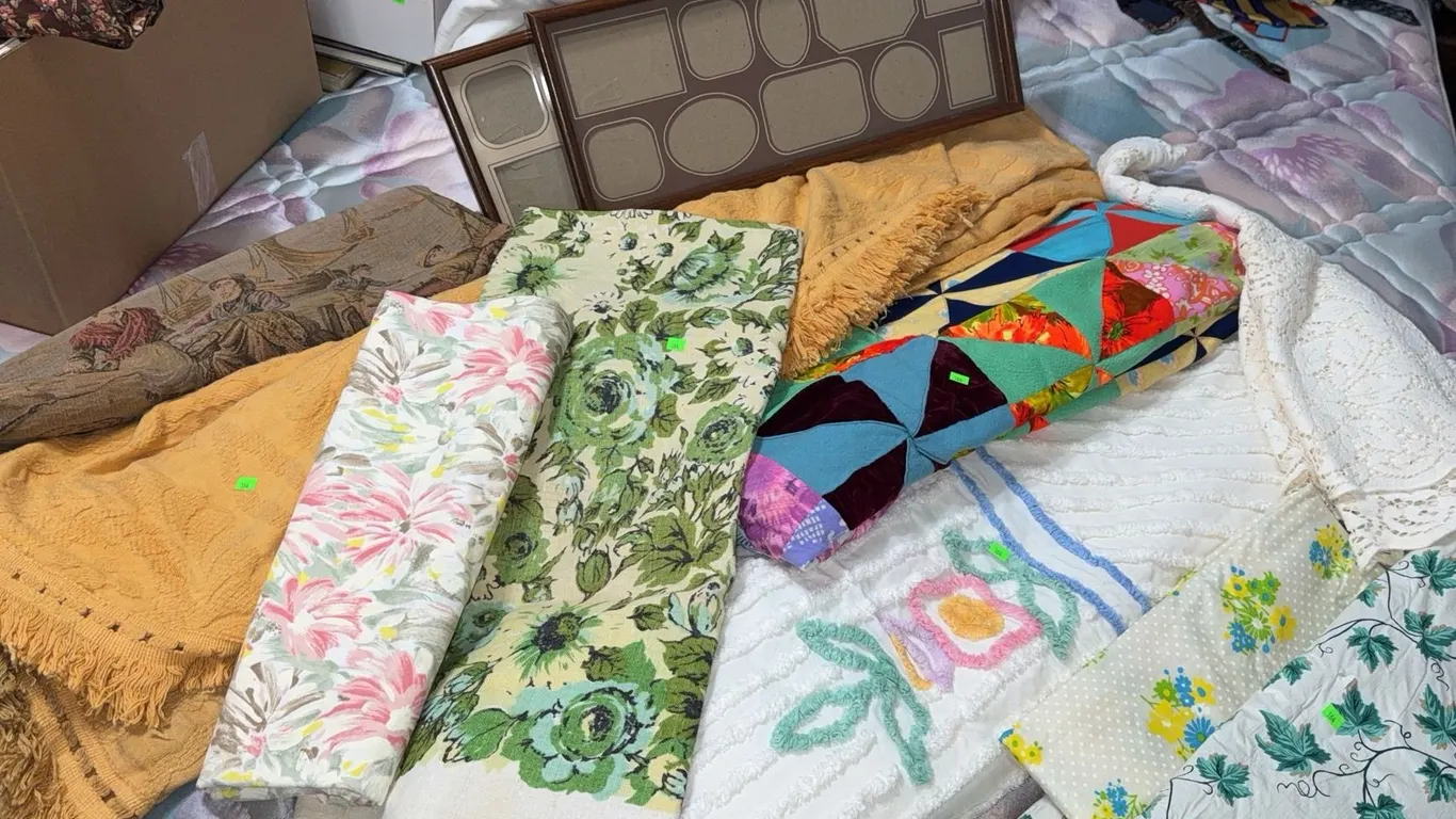 Textile Lot Including Quilts, Tablecloths, Tapestry, and Fabric Panels