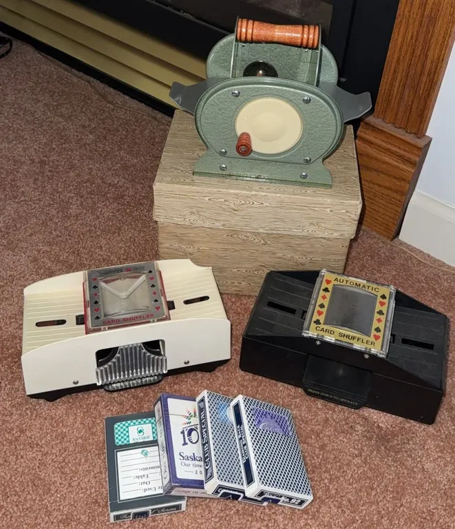 Three Card Shufflers and Four Decks of Playing Cards