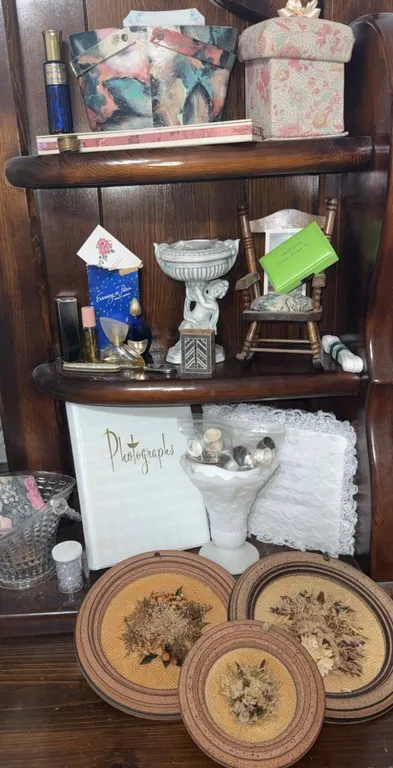 Decorative Shelf Lot with Photo Album, Trinket Boxes, and Dried Floral Plaques