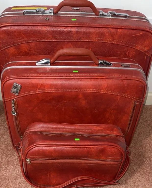 Three-Piece Red Faux Leather Luggage Set with Silver-Tone Hardware