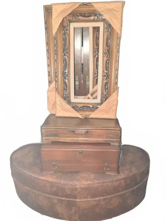 Carved Wood Framed Mirror, Two Wooden Jewelry Boxes, and Oval Upholstered Ottoman on Casters