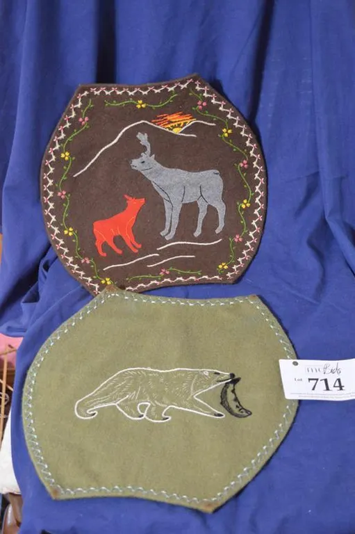 Green Duffle With Polar Bear Holding A Fish. Brown Duffle With Mother Cariboo And Baby